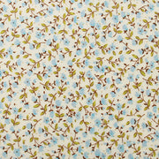 a repeating pattern of blue flowers and green leaves on a light-colored background.