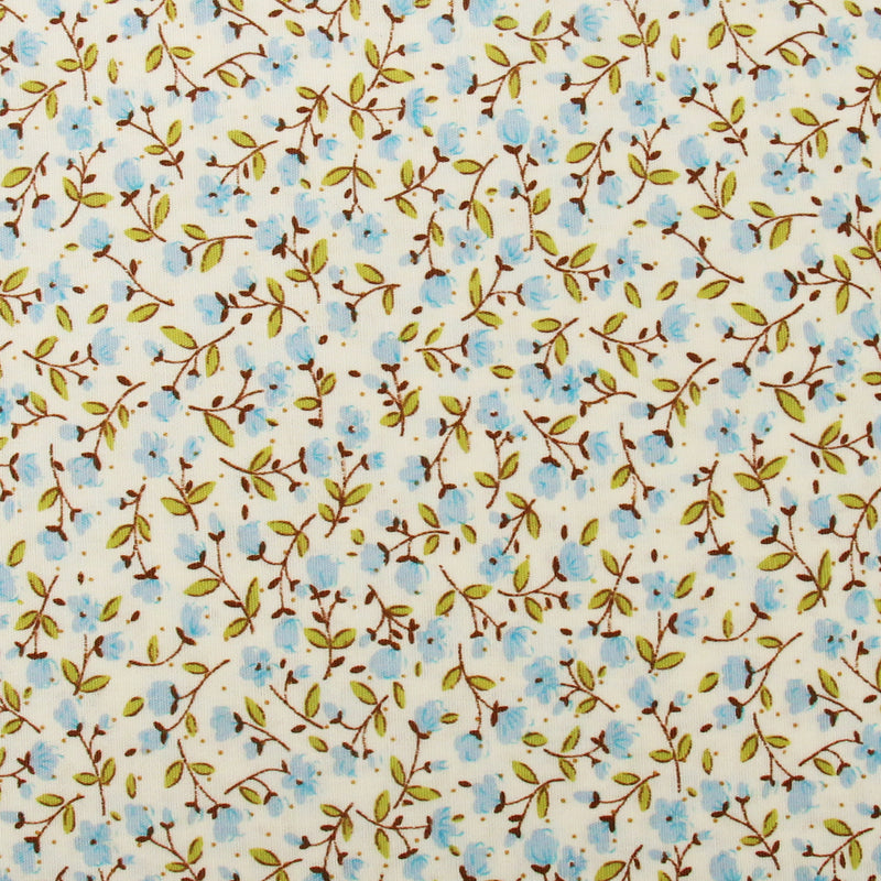 a repeating pattern of blue flowers and green leaves on a light-colored background.