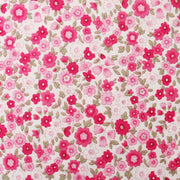 a pattern of pink and white flowers with green leaves, creating a visually appealing and vibrant design.