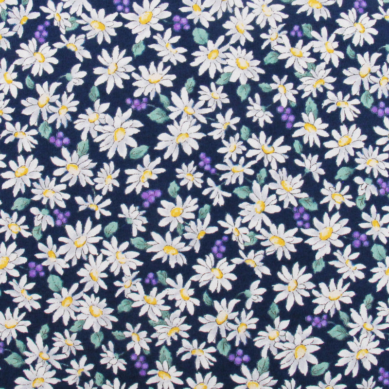 a pattern of white daisies with yellow centers against a dark blue background.
