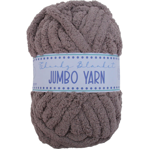A ball of chunky, brown yarn labeled as a jumbo yarn.