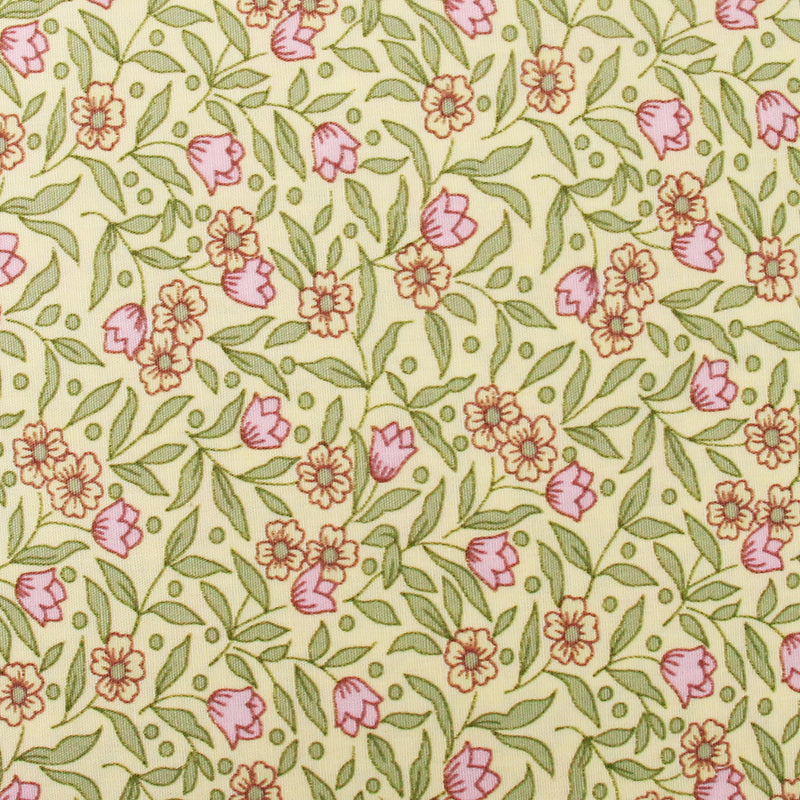a repeating floral pattern with pink flowers and green leaves on a yellow background.