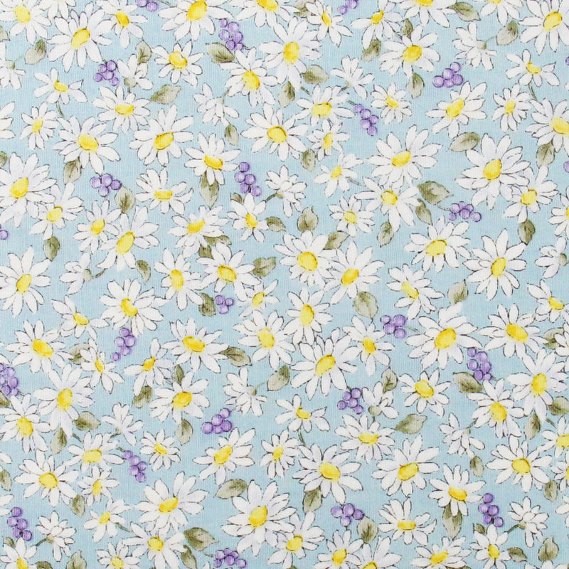 The image is a collage of various flowers, including daisies and grapes, against a light blue background.