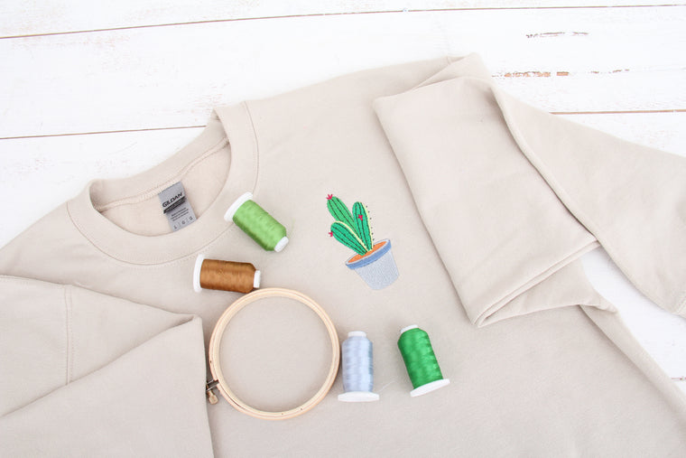 A tonal cactus on a cozy sweatshirt