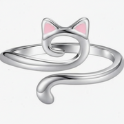 Silver cat-shaped ring with pink accents on a white background
