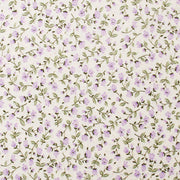 a repeating pattern of small purple flowers and green leaves on a light-colored background.