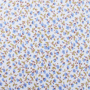 a repeating pattern of blue flowers and green leaves on a white background.