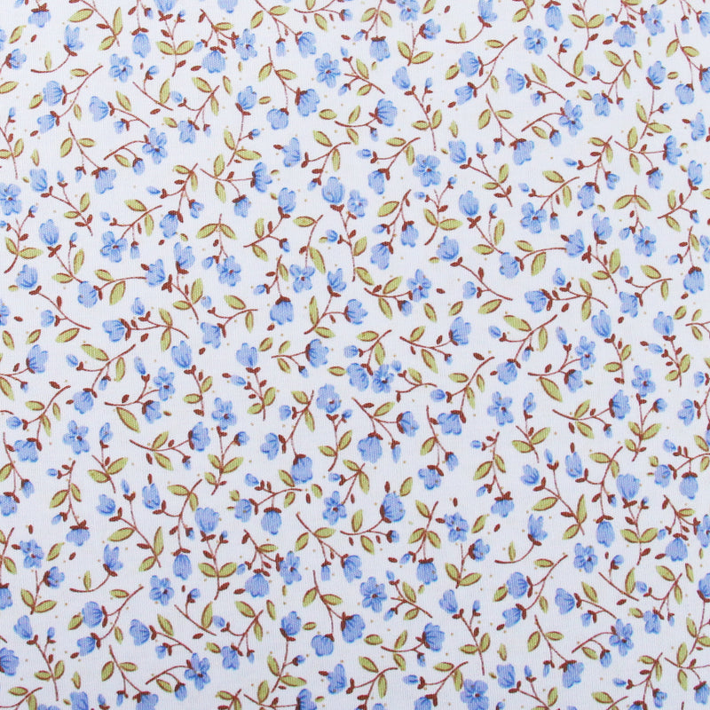 a repeating pattern of blue flowers and green leaves on a white background.