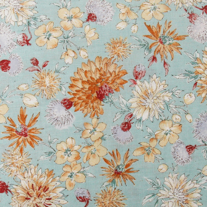 a vibrant and colorful floral pattern with various types of flowers in shades of orange, yellow, and white against a light blue background.