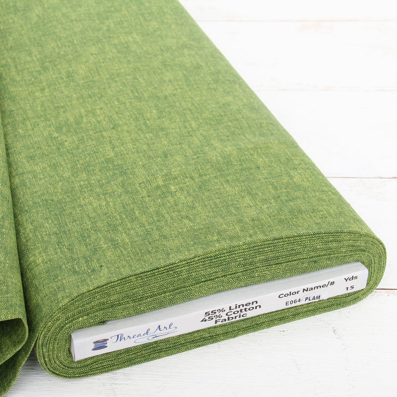 Palm green yarn dyed homespun cotton linen blend fabric on the bolt