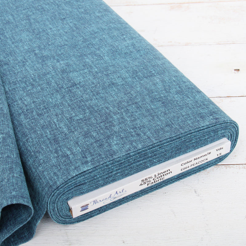 Peacock blue yarn dyed homespun cotton linen blend fabric on the bolt