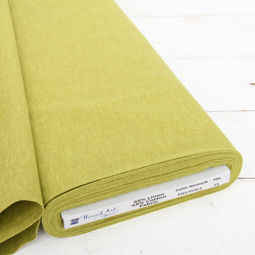 Pickle green yarn dyed homespun cotton linen blend fabric on the bolt