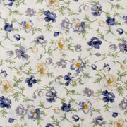 a repeating pattern of blue and white flowers on a light background.