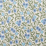 a repeating pattern of blue flowers and green leaves on a white background.