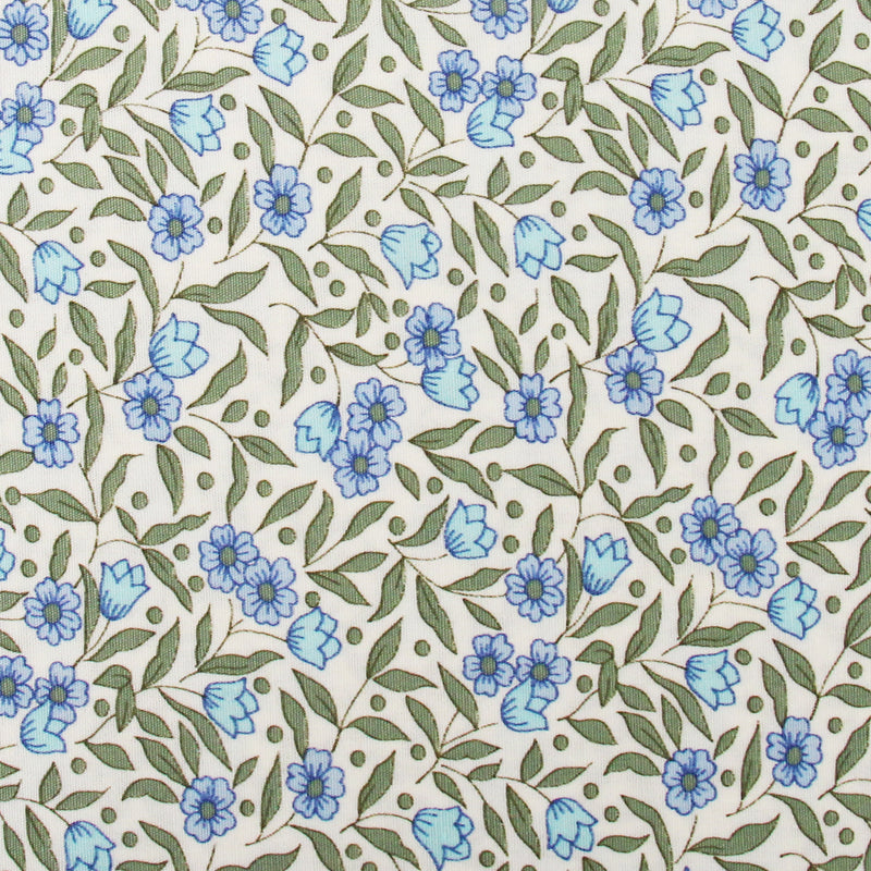 a repeating pattern of blue flowers and green leaves on a white background.