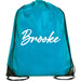A turquoise backpack with the name "Brooke" printed on it in white text.