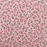 a repeating pattern of pink flowers and green leaves on a light pink background.