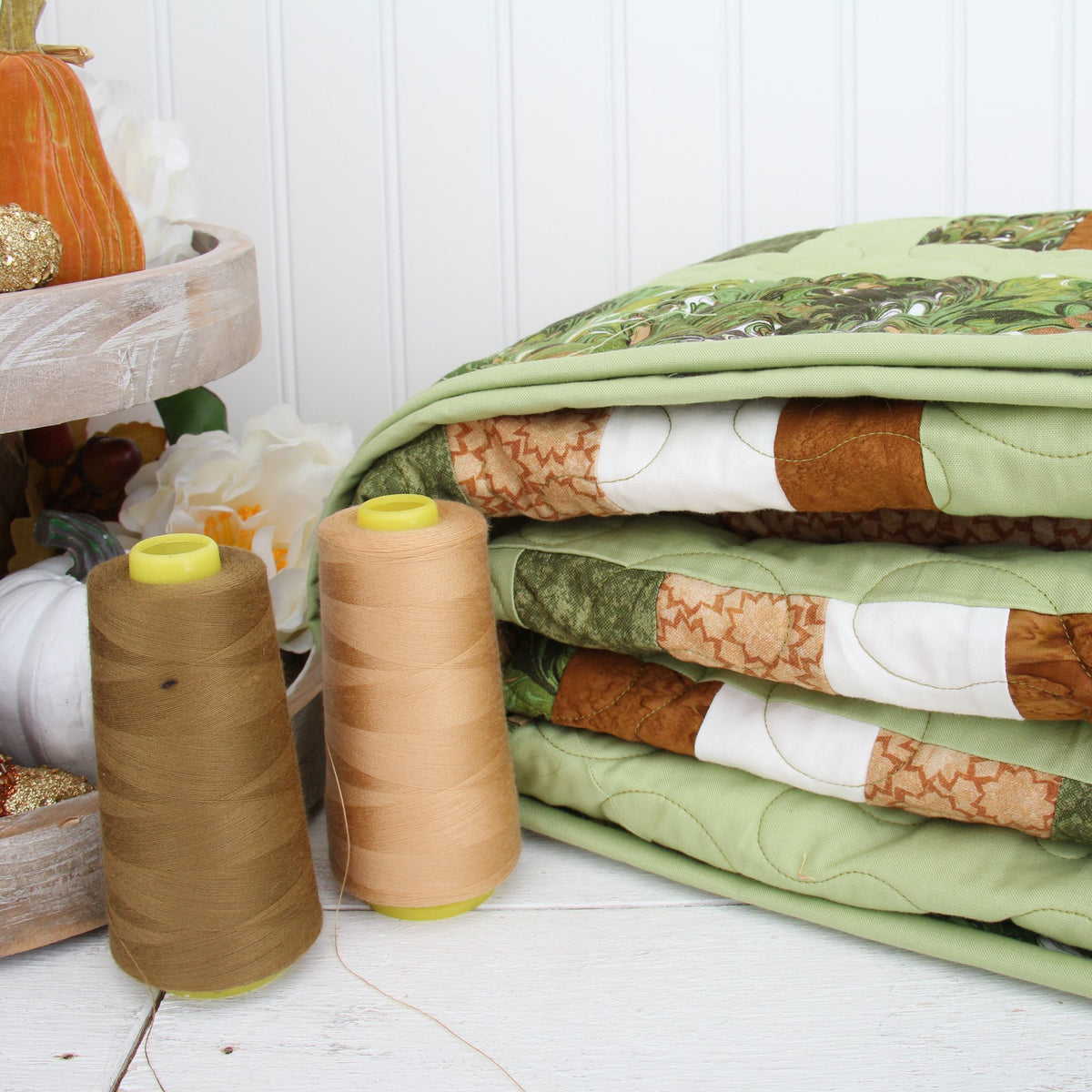 Folded fall quilt with cotton thread cones