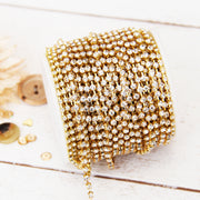 Rhinestone Chain SS10 - 10 yd Roll - Crystal/Gold - Threadart.com